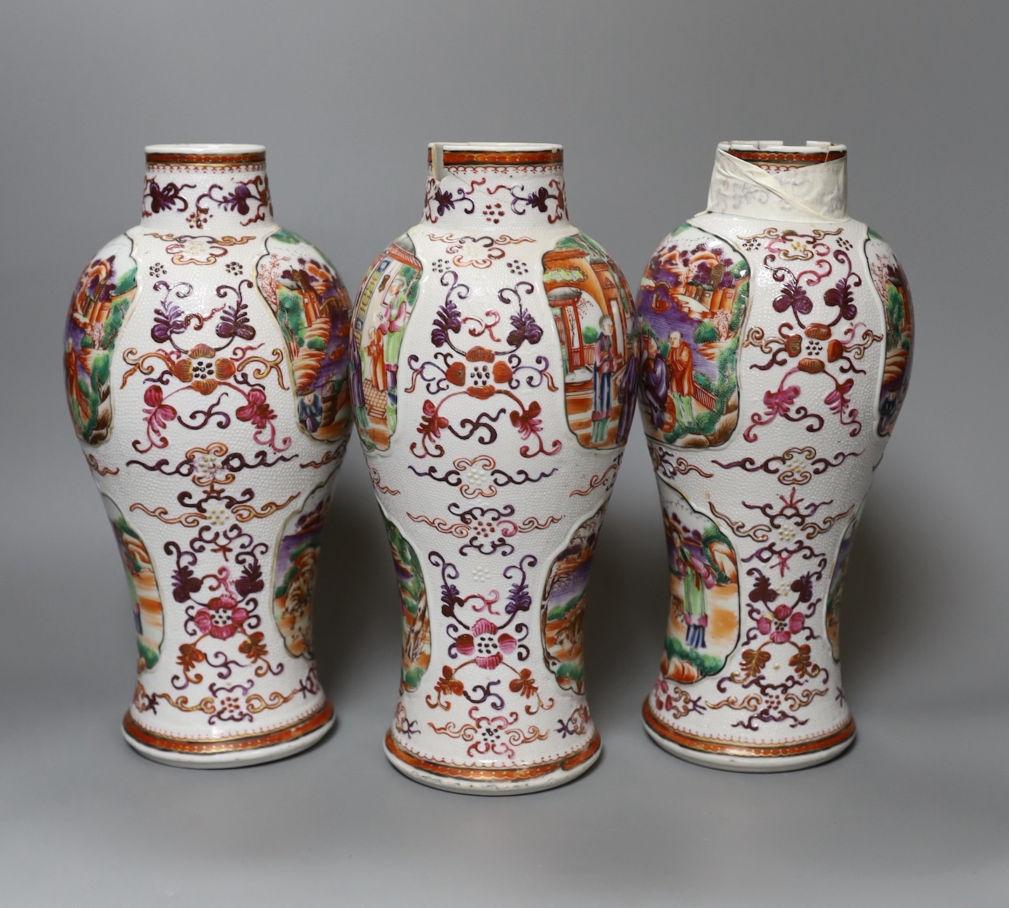 A set of three Qianlong famille rose baluster vases, 24.5cm tall